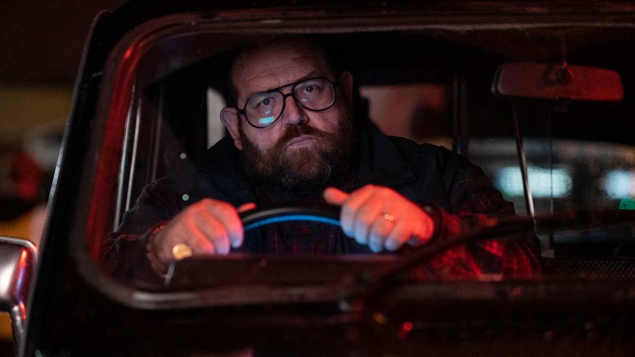 Nick Frost behind the wheel of a vehicle in Black Cab.