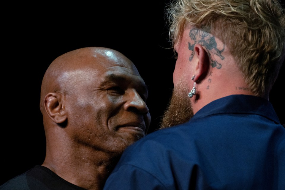 Mike Tyson and Jake Paul face off during a news conference, ahead of their big fight