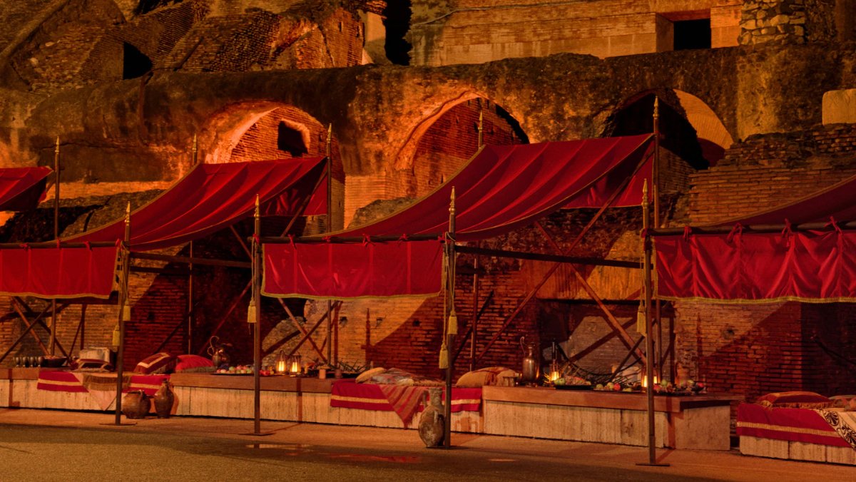 Roman-style canopies with food spreads underneath them.