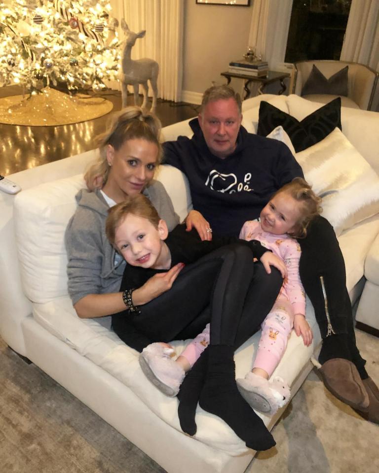 PK and Dorit snuggle with their kids in their cozy living room