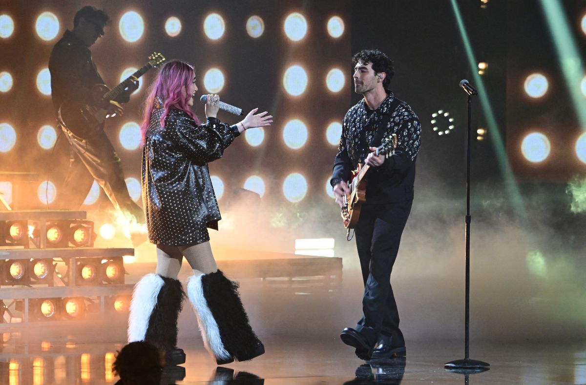 Joe Jonas and  Ela Taubert perform on stage