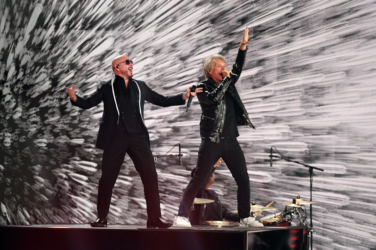 Pitbull and Jon Bon Jovi perform onstage 