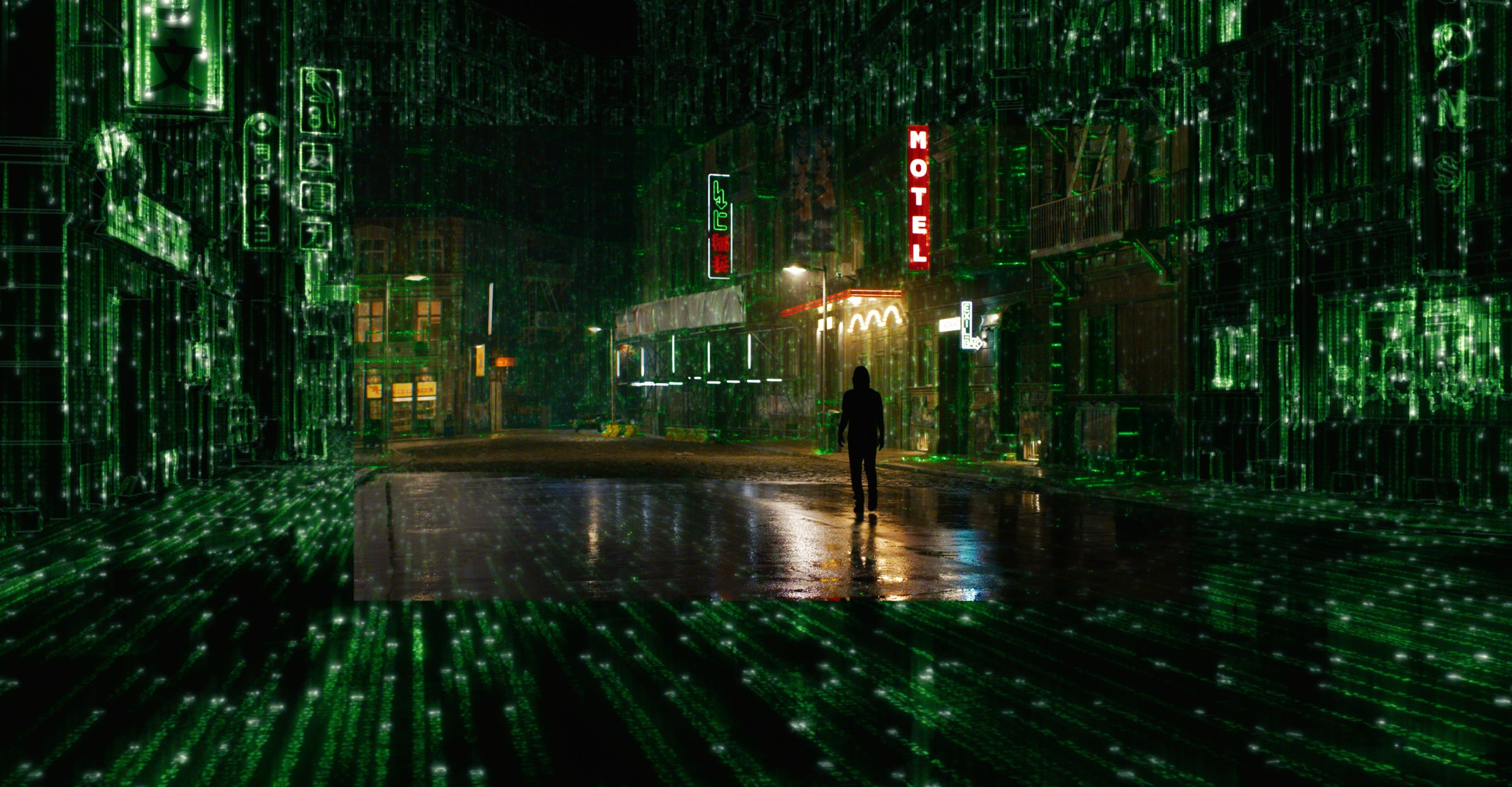 Thomas Anderson walks through a city street as it devolves into code in The Matrix Resurrections.