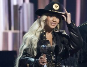 Beyonce, left, accepts the Innovator Award during the iHeartRadio Music Awards, April 1, 2024, at the Dolby Theatre in Los Angeles.