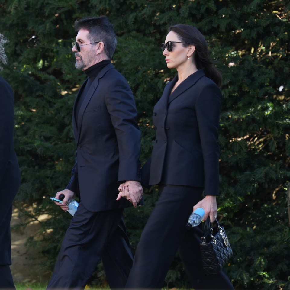 Simon Cowell and partner Lauren Silverman outside the church