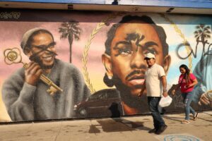 A defaced mural of Kendrick Lamar