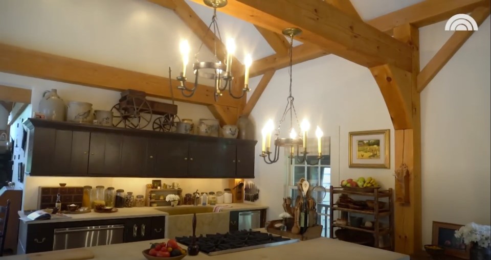 The kitchen has wood beams for a modern touch