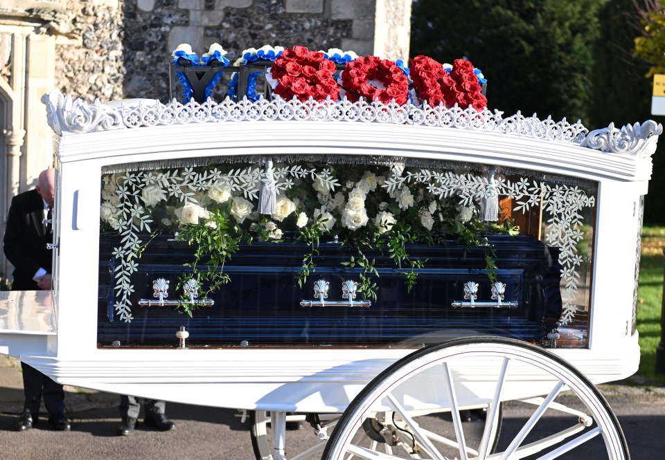 A floral tribute spelling 'son' above Liam's coffin