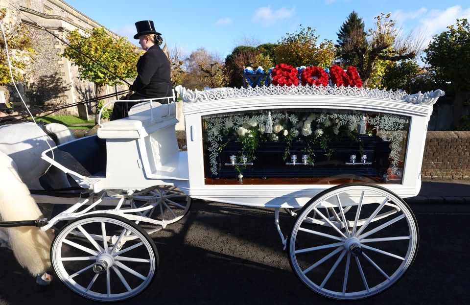 Tributes were placed on the top of a white carriage