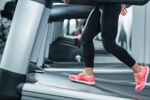 woman incline walking on treadmill