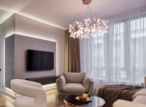 A modern chandelier hanging in a living room