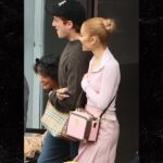 Ariana Grande arrives in Sydney arm in arm with boyfriend Ethan Slater