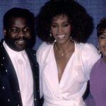 Singer BeBe Winans, singer Whitney Houston and singer CeCe Winans attend an awards dinner in 1990.