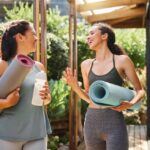 Two women take a yoga class together