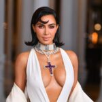 Kim Kardashian oozed glam in a plunging white halterneck dress