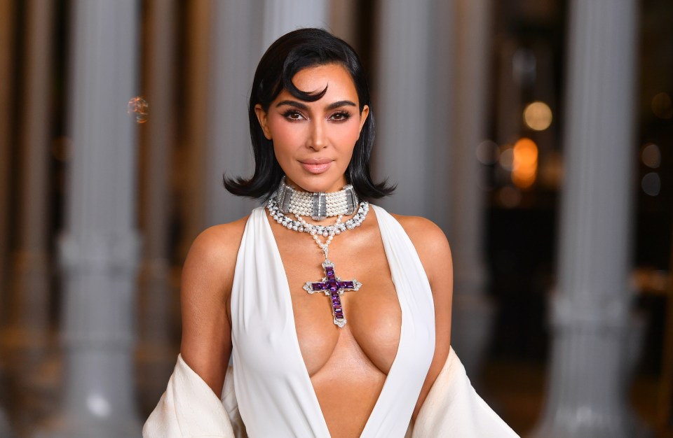 Kim Kardashian oozed glam in a plunging white halterneck dress