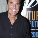 Legendary Wheel of Fortune presenter Chuck Woolery dies aged 83 after TV star 'fell suddenly ill' at his Texas home