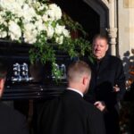 Geoff and Karen Payne behind their son's coffin