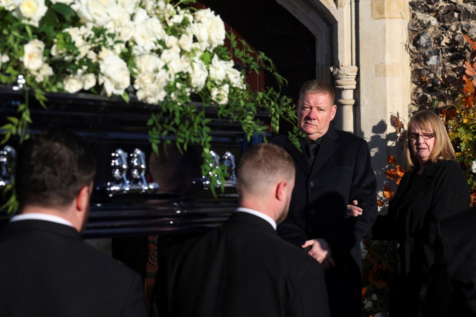 Geoff and Karen Payne behind their son's coffin