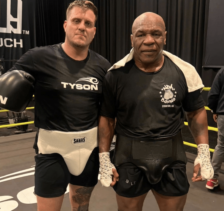 Sparring partner Mike Russell with Tyson