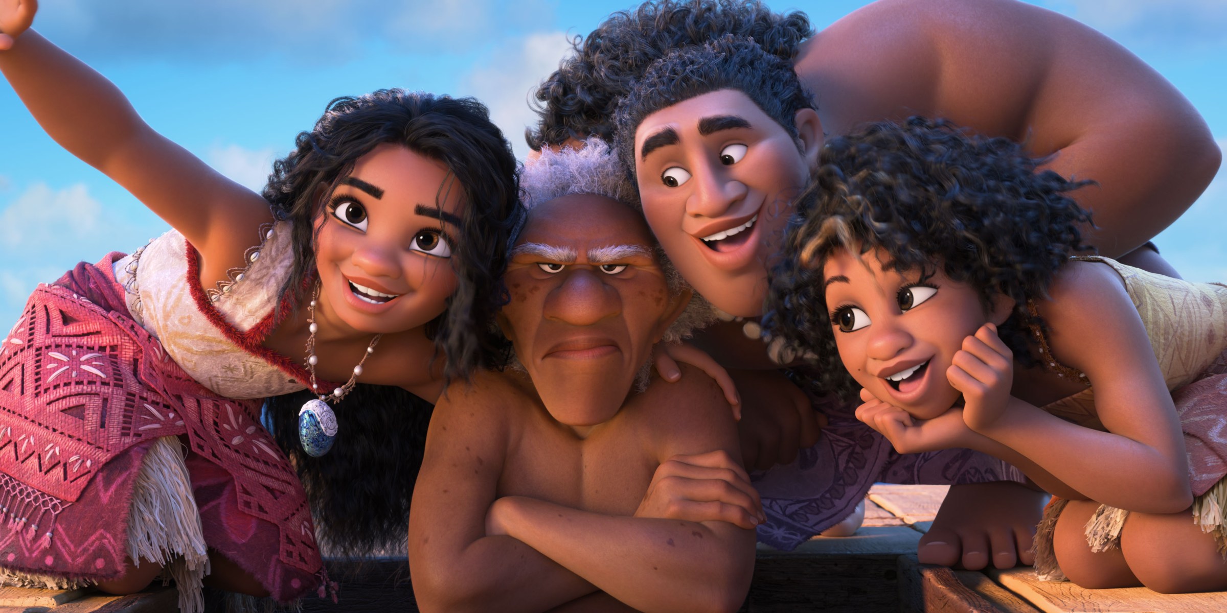 Moana gathers her new crew (scowling old man Kele, big hunky Moni, slim grinning Loto) and holds up her hand to show them how she navigates, but the framing deliberately looks like she’s taking a selfie of all of them together in Moana 2