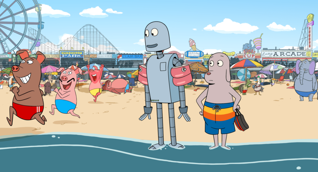 Dog and Robot at the beach — amusement park rides and boardwalk restaurants are visible behind them. They watch as three pigs in bathing suits dash towards the water in Robot Dreams.