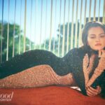 Selena lying down on the job in a sparkly two-tone dress