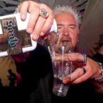 Guy Fieri pouring Santo tequila