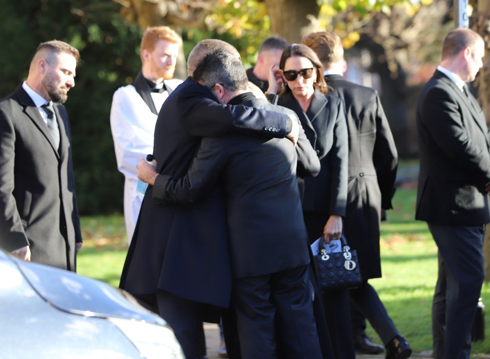 Simon Cowell hugging Liam Payne’s mum Karen and dad Geoff goodbye