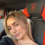 Emelia Hartford pictured in a Lamborghini