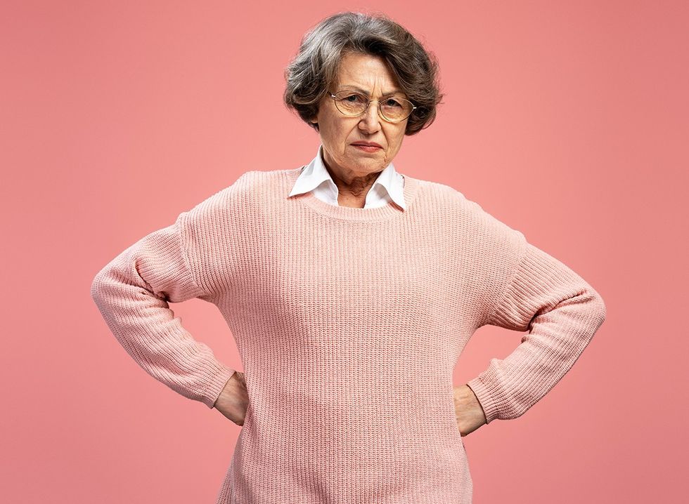 An older woman wearing plain clothing