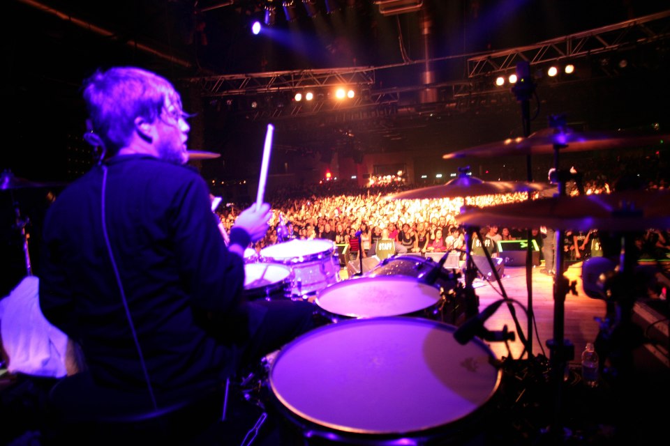 Bryar on stage with the band in Italy