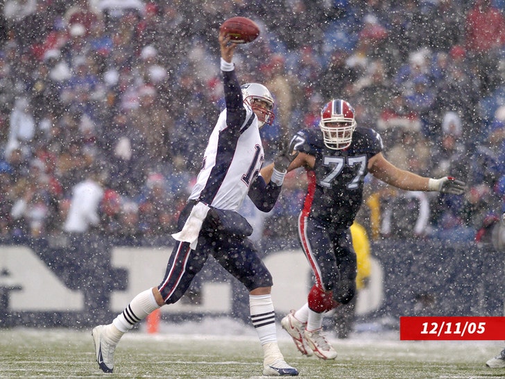 New England Patriots quarterback Tom Brady delivers a pass in snowy conditions during a game against the Buffalo Bills at Ralph Wilson Stadium in Orchard Park, New York on December 11, 2005