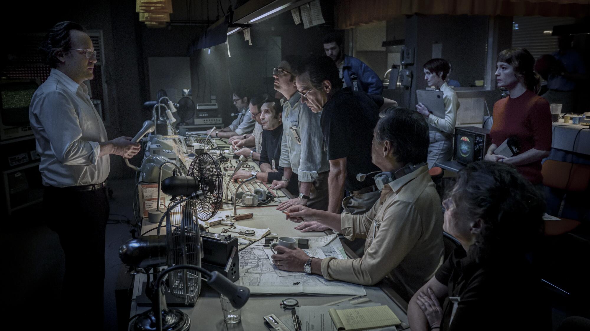 A producer leads a news team in the control room in "September 5."