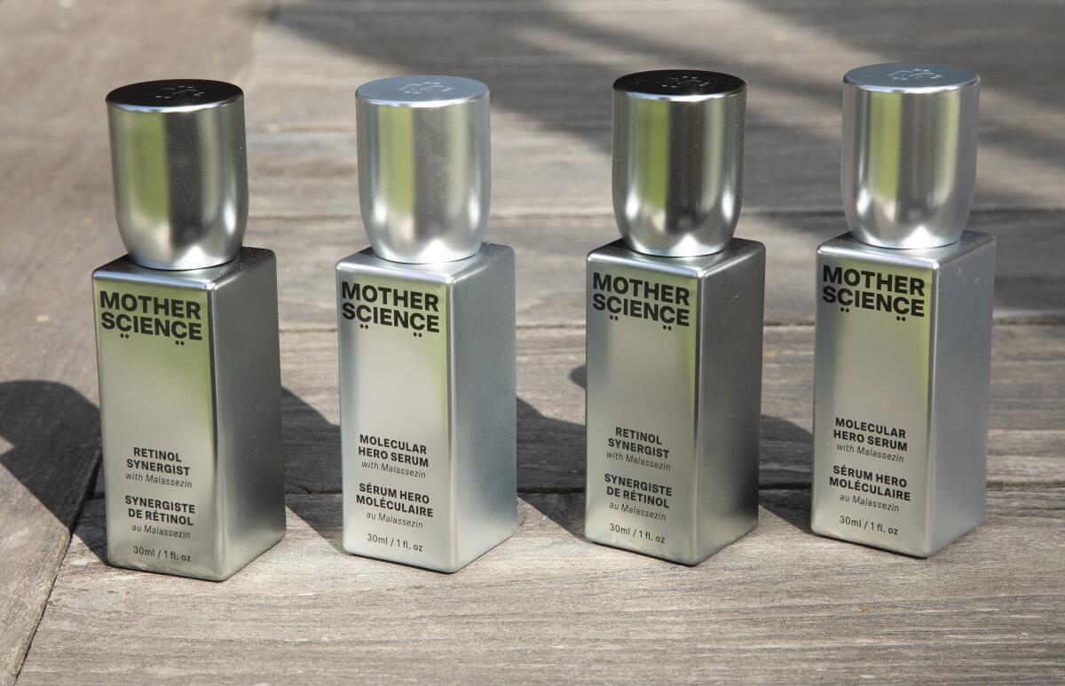 Four silver bottles labeled Mother Science