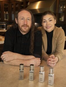 Ann Marie Simpson-Einziger and Mike Einziger with a line of silver product bottles