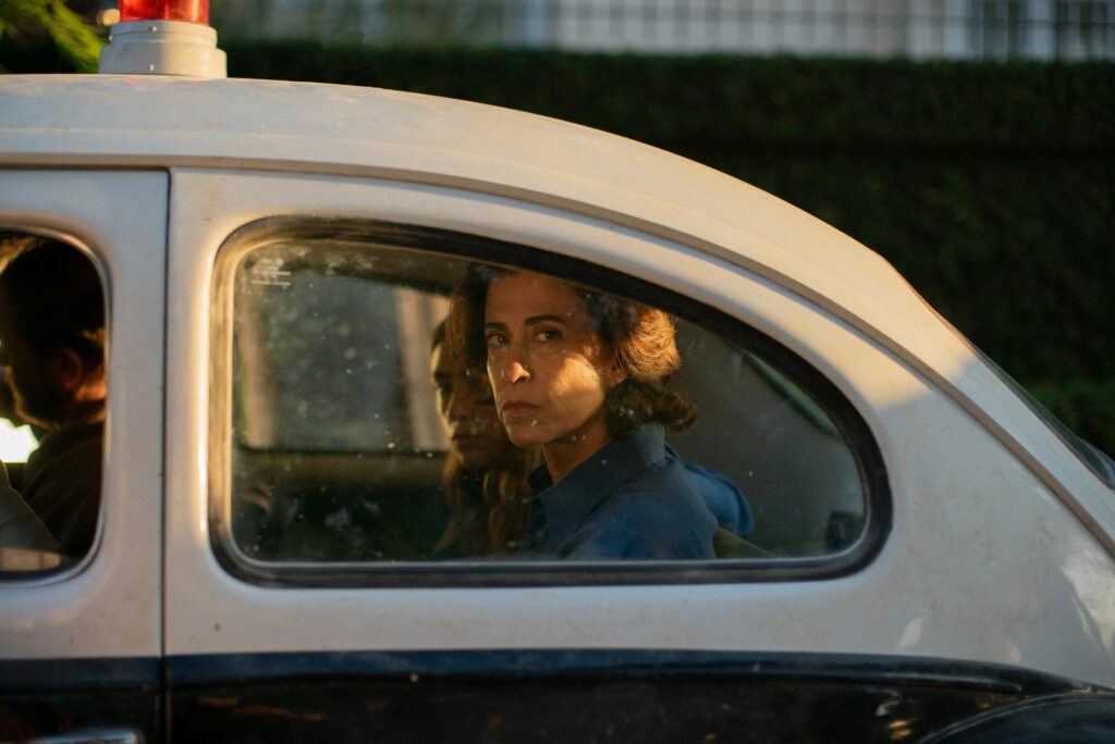 Woman in car looks out the window