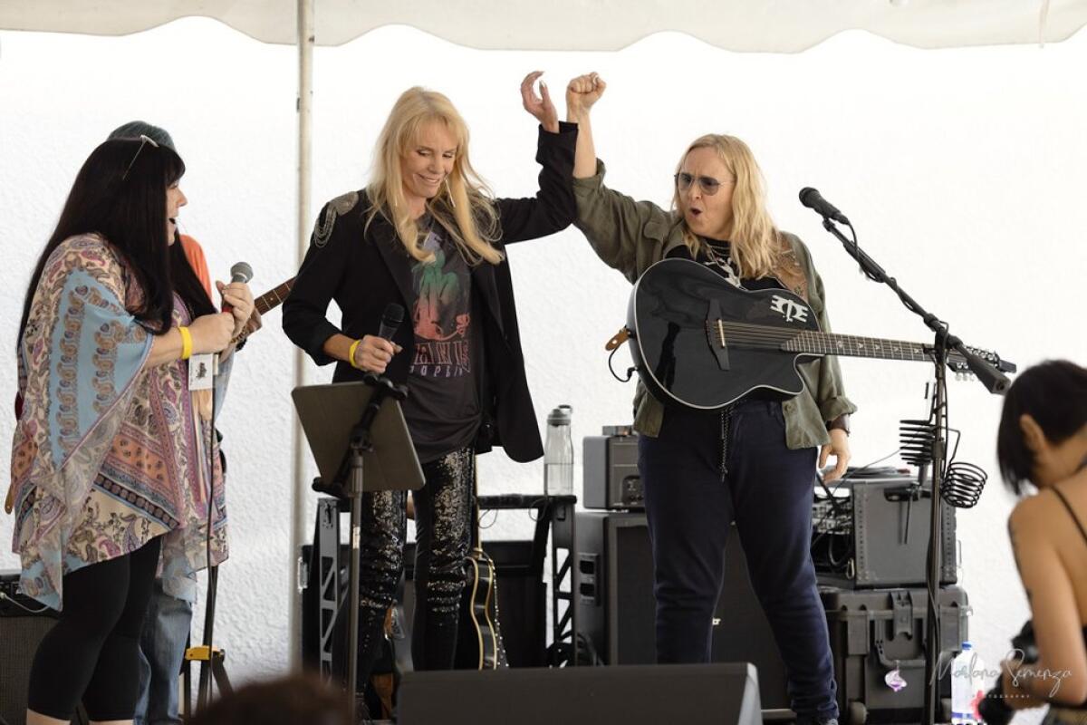 Melissa Etheridge on stage with campers at Women's Rock Camp.