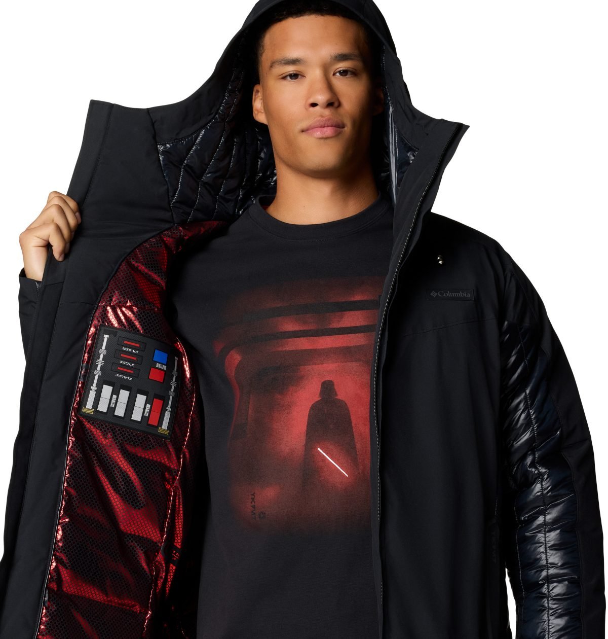 Person wearing a Darth Vader jacket and holding it open to show the details