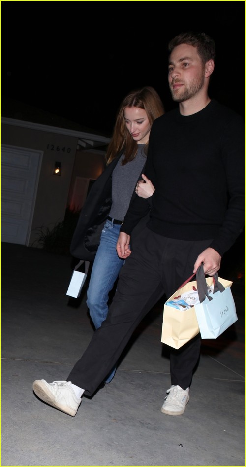 Phoebe Dynevor and Cameron Fuller at the Jennifer Klein holiday party