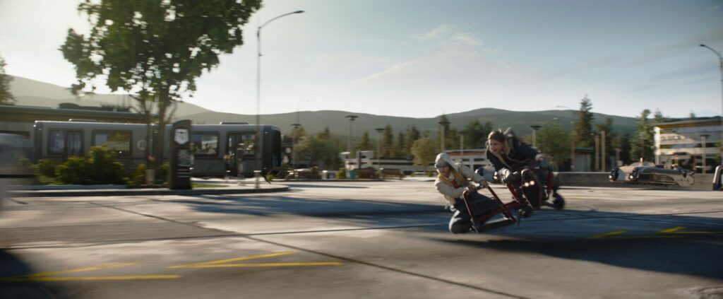 two girls riding on a speeder bike