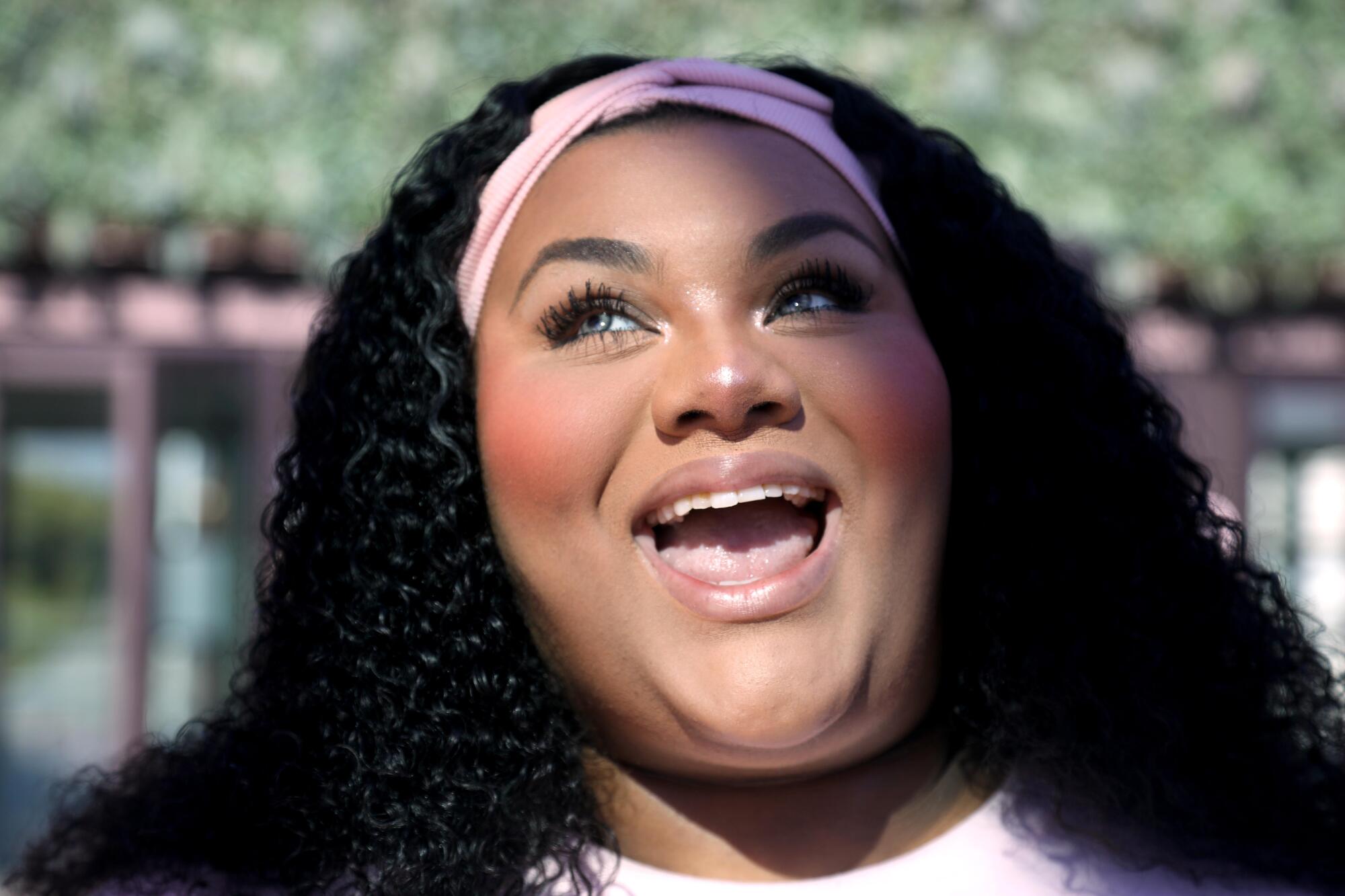 TikTok creator Aaliyah Arnold is all smiles before selling her brand of makeup