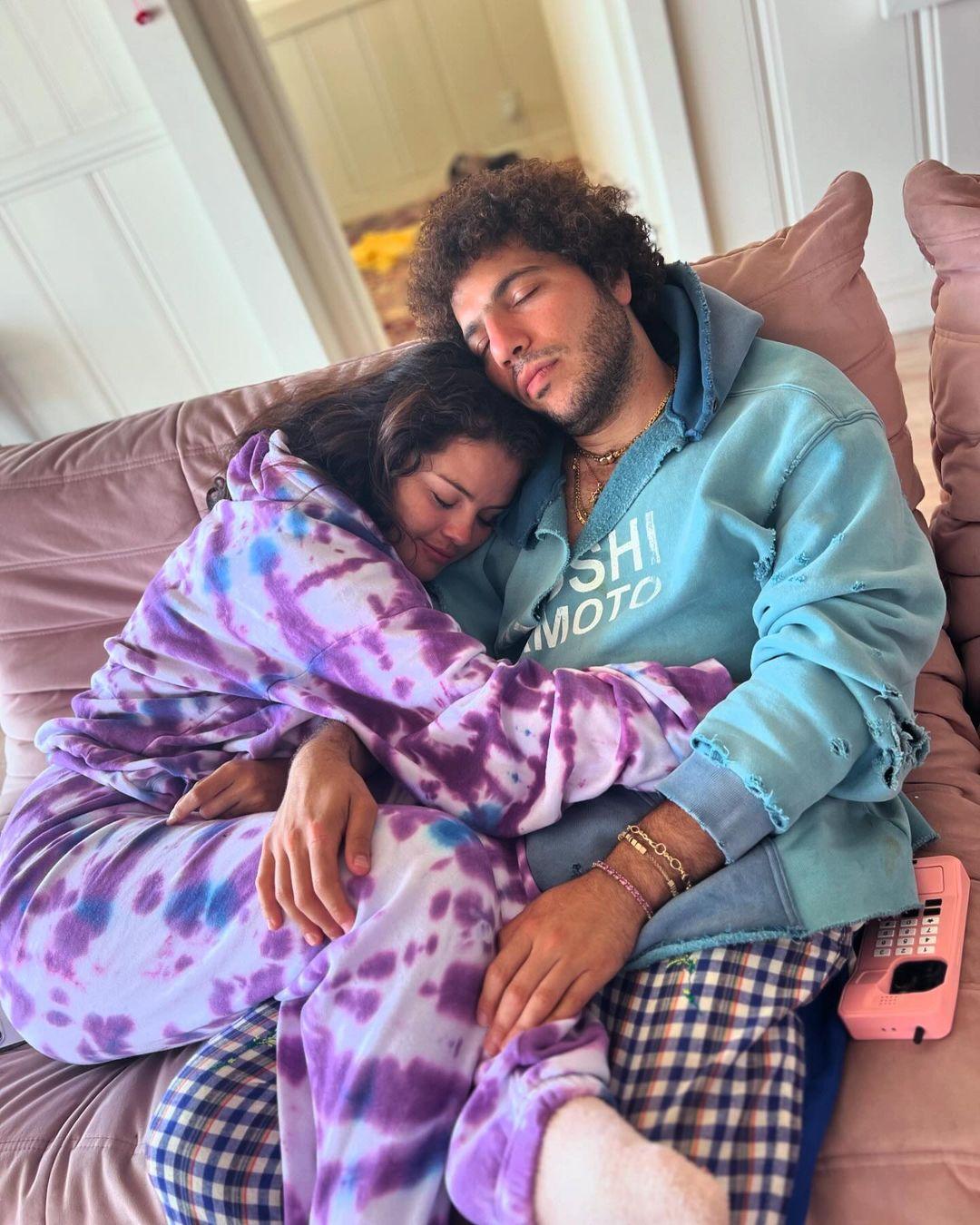 Selena Gomez and Benny Blanco cuddle on couch