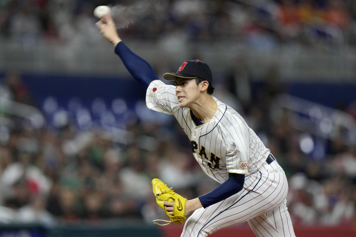 Japan pitcher Roki Sasaki pitches during the World Baseball Classic.