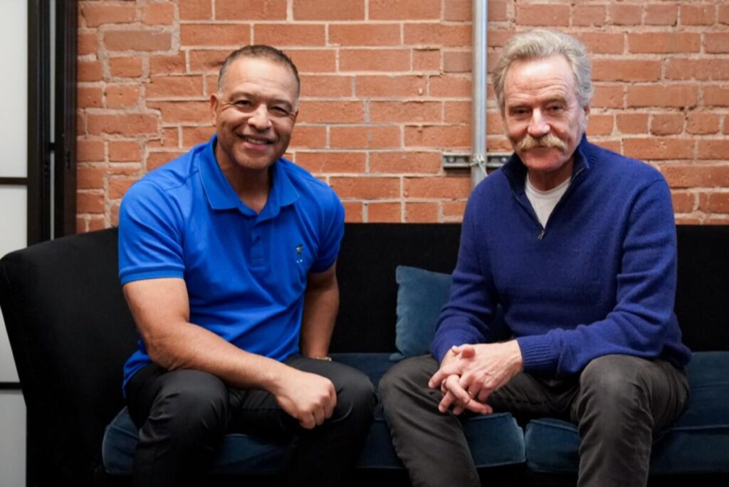 Dodgers manager Dave Roberts, left, and actor Bryan Cranston.