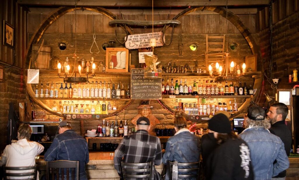 People seated at the bar at Pappy & Harriet's in Pioneertown.