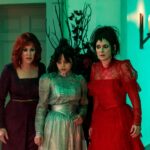 Three women of varying ages look startled in "Beetlejuice Beetlejuice."