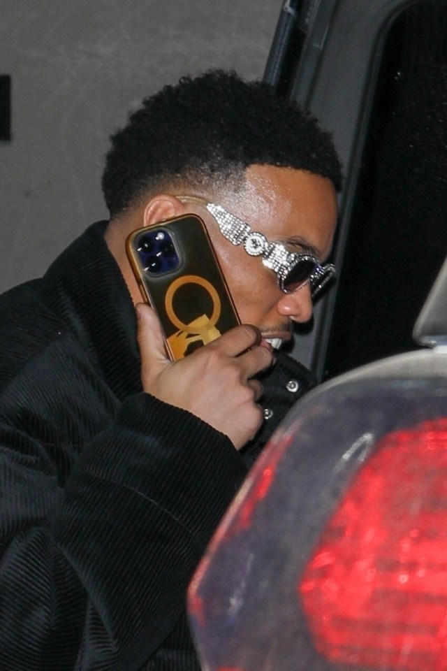 Anderson .Paak wore a pair of blinged sunglasses and took a call on his cell as they left the restaurant