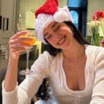 Dua Lipa hid her left hand in a sweet Christmas snap after her engagement was revealed