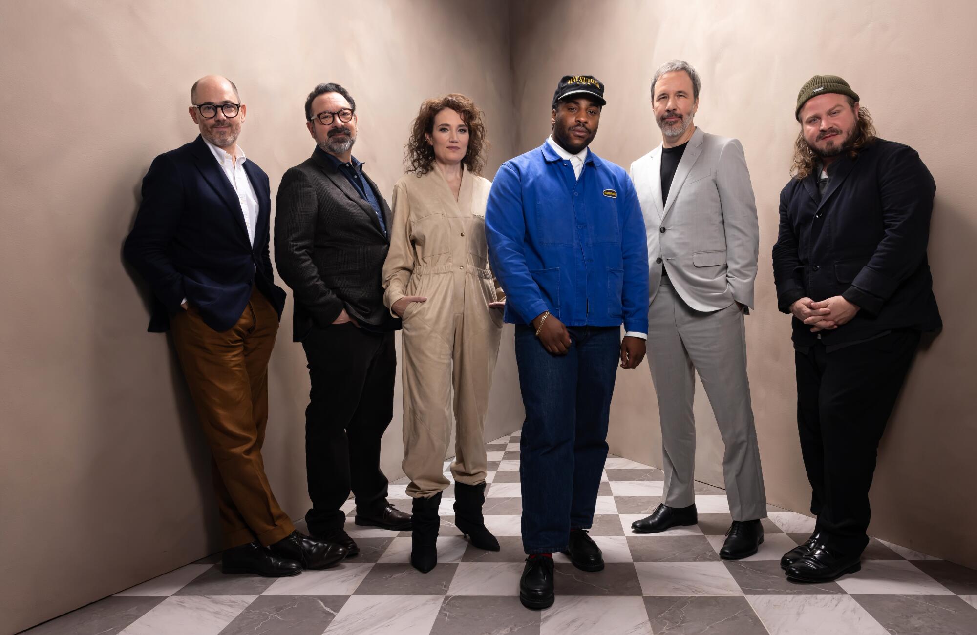  A group of directors, five men and one woman, stand for a group portrait.